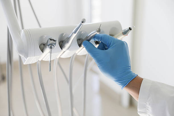 Professional Tooth Extraction technician working in Prudenville, MI
